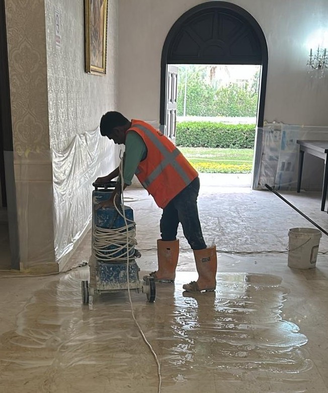 Seyana technician polishing marble floor in a Kuwaiti villa